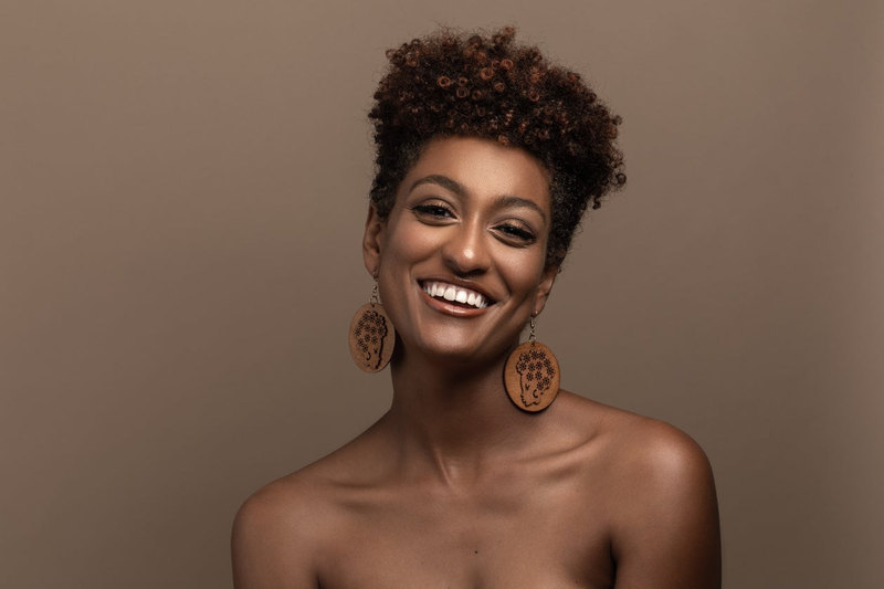 Studio portrait of a smiling woman.